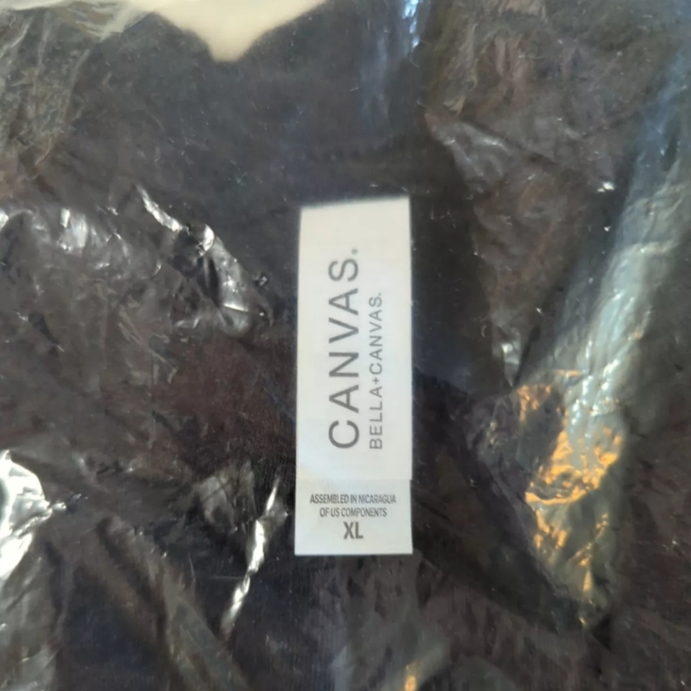 New in original packaging. The Athletic black T shirt. Size XL.